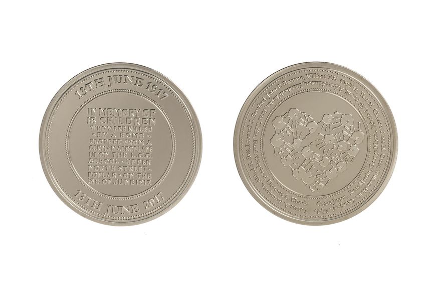 Silver medal commemorating the 100th anniversary of the bombing of Upper North Street School, Poplar in 1917 | collection photography | © British Red Cross Museum & Archives